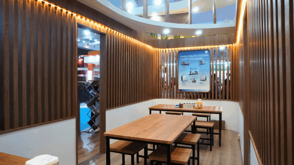 Interior booth EBARA Indonesia di Indowater 2025 dengan area diskusi dan display produk