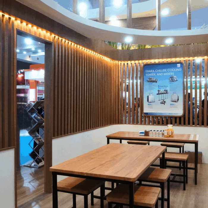 Interior booth EBARA Indonesia di Indowater 2025 dengan area diskusi dan display produk